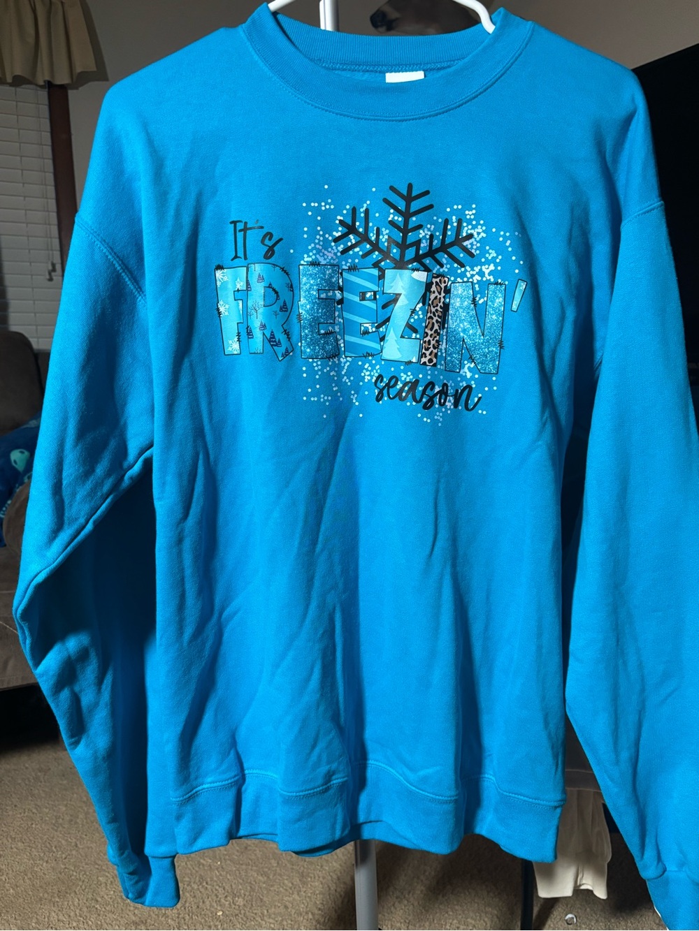 Bright Blue Crewneck Sweater with 'Freezin' Season' Snowflake Graphic
